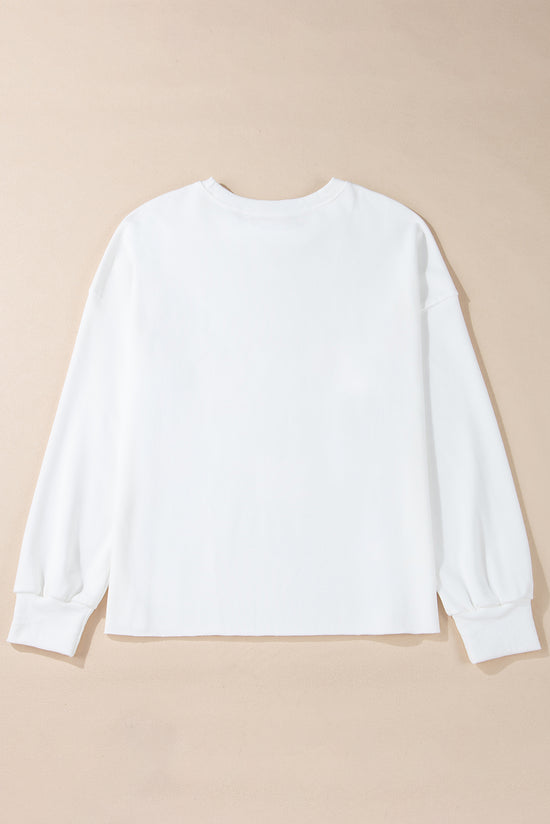 White loose sweatshirt with bow tie pattern and dropped shoulders