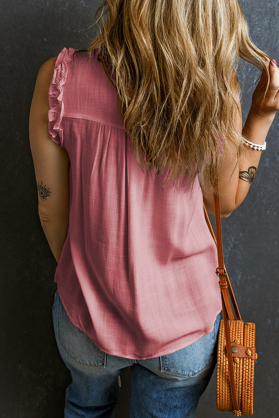 Pink button-up tank top with split neck and ruffle trim