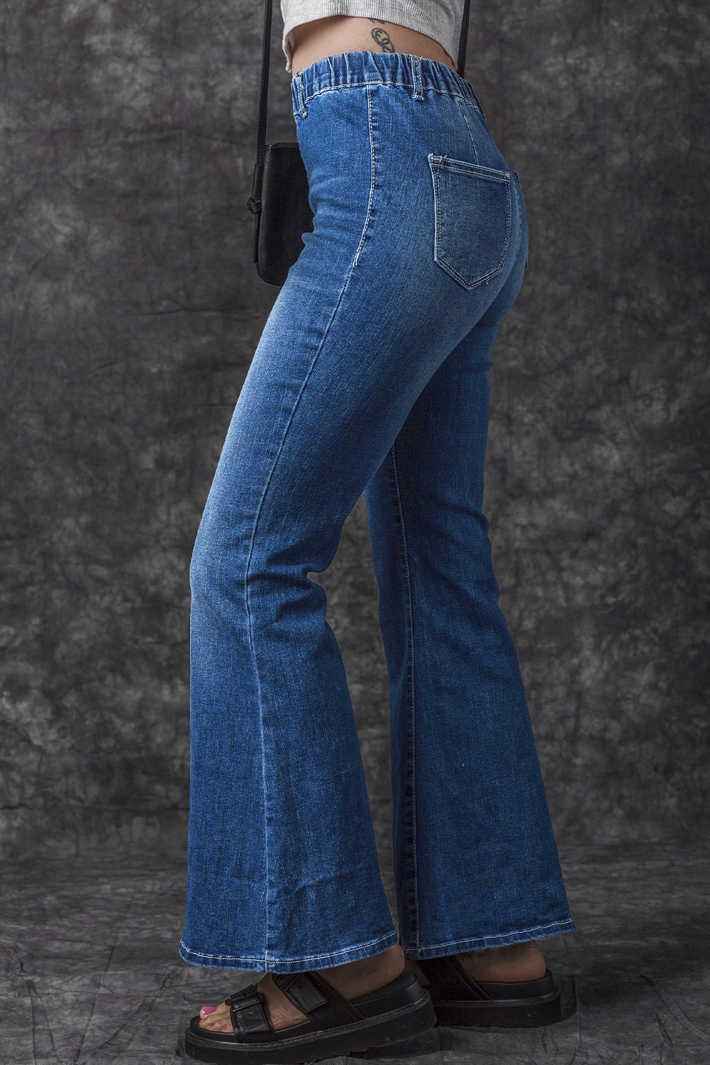 Jeans a bagliore a vita alta elastica blu