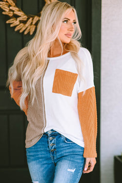 Orange textured knit top with long sleeves and color block chest pocket