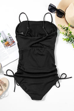 Swimsuit A ribbed black room with tightening cord and cutting on the sides