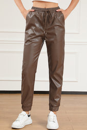 Brown leather jogging pants with waist tie