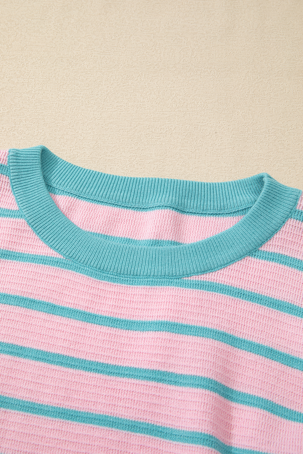 Loose sweater with pink stripes and round neck, dropped shoulders