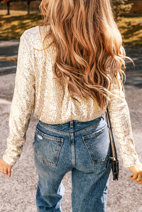 Beige body with glitter and long sleeves, v * collar