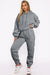 Set of plain gray sports clothes with hooded sweatshirt and jogging pants with falling shoulders