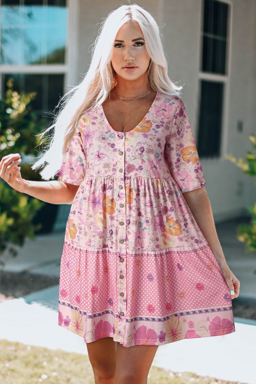 Multicolored ruffled mini dress with hibiscus floral print