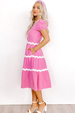 Mid-length fluid dress with short puffing sleeves and candy ric rac border