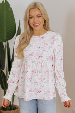 Babydoll pink blouse with floral print and frozen balloon sleeves with lock hole on the back