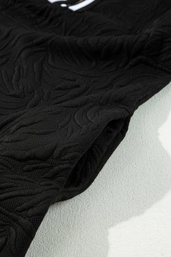 Mini-Darling negro derecho en Jacquard con cremallera en un cuarto