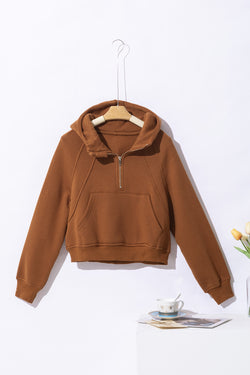 Brown hoodie with kangaroo pocket and quarter-turn zip