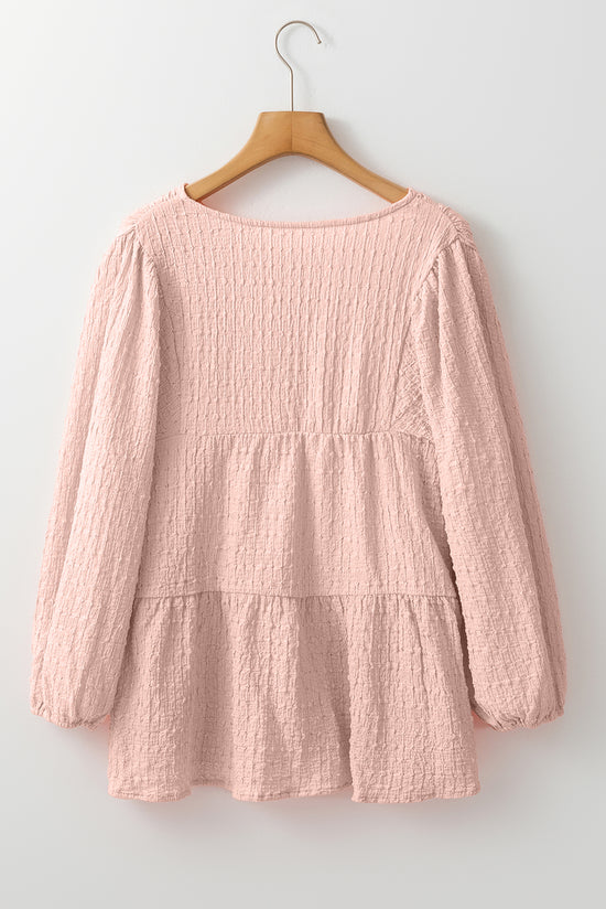 Light pink textured fluid blouse on several levels