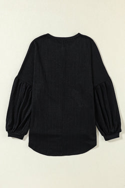 Black long puff sleeve top in faux knit jacquard