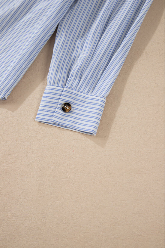 Long sleeve shirt buttoned with sky blue striped