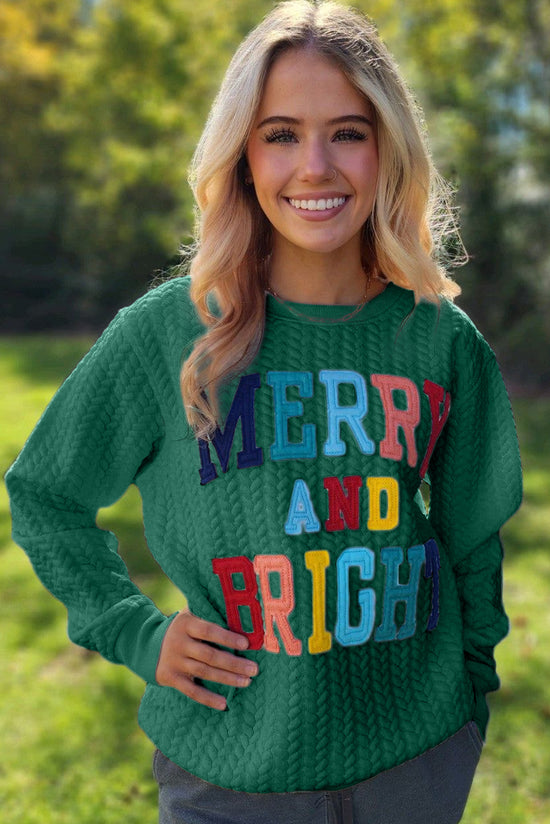 Bright and cheerful cable knit sweatshirt in blackish green