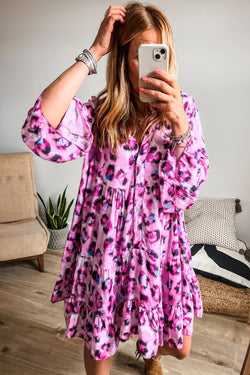 Bouton dress on the front with pink leopard print, 3/4 sleeves and ruffle hem