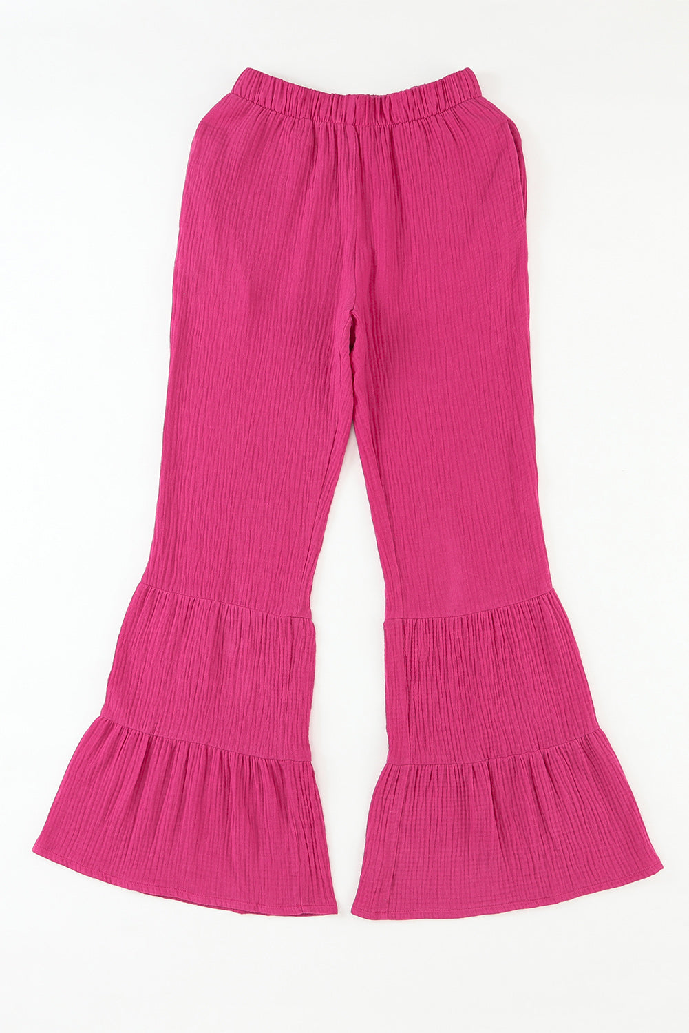 Pantalones acampanados con volantes y cintura alta con textura rosa