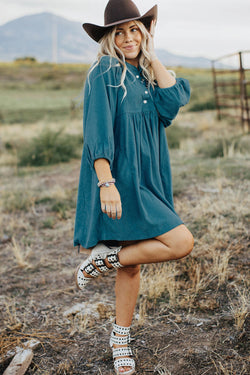 Blue sleeve dress and ribbed velvet bracelet with press pimples and empire waist