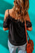 Black top with short sleeves and bare shoulders with hook neckline