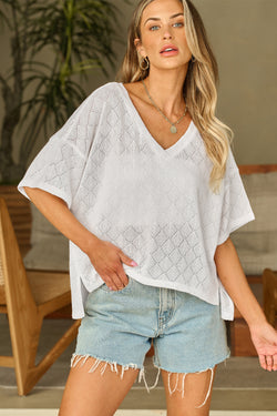 Fluid white knitted blouse with v -neck collar