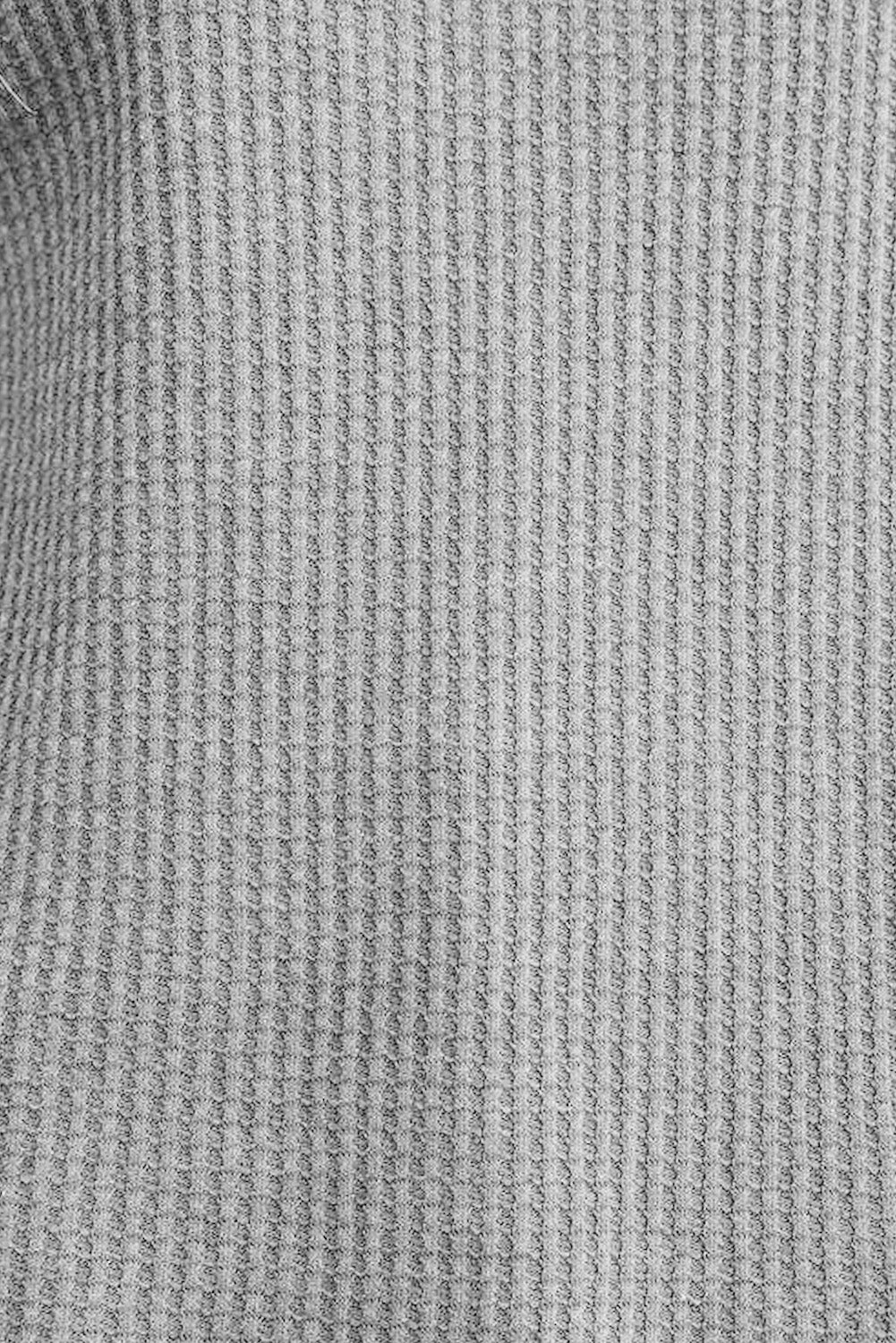 Grey waffle knit top with ribbed trim and crew neck