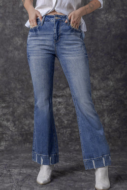 Lightly distressed sky blue flared jeans with a medium wash