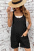 Black textured romper with adjustable straps and pockets