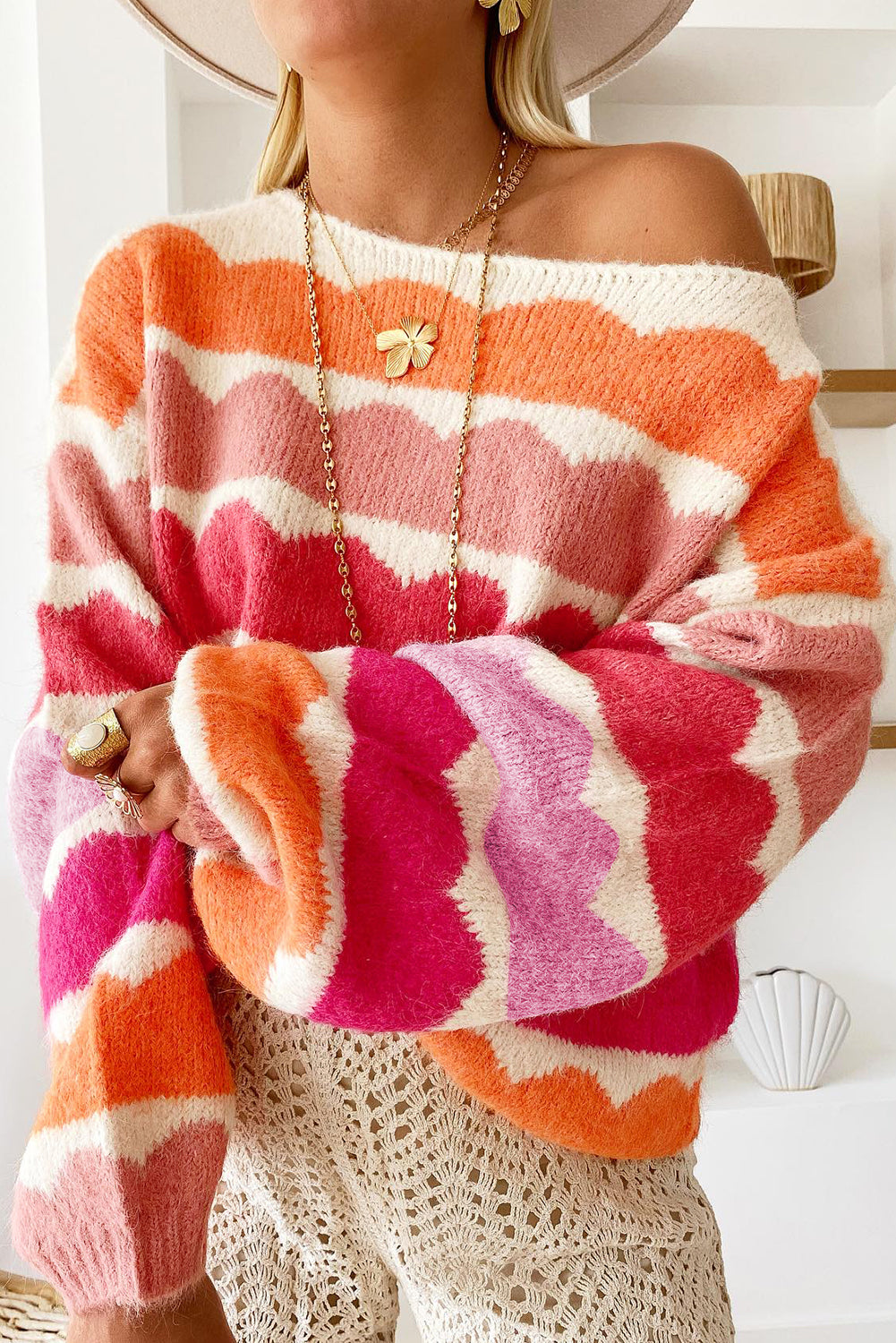 Pink red striped sweater with balloon sleeves and dropped shoulders