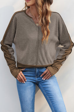 Brown top with thumbhole sleeves and contrasting patchwork