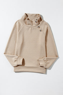 Apricot textured mock neck sweatshirt with asymmetrical buttons