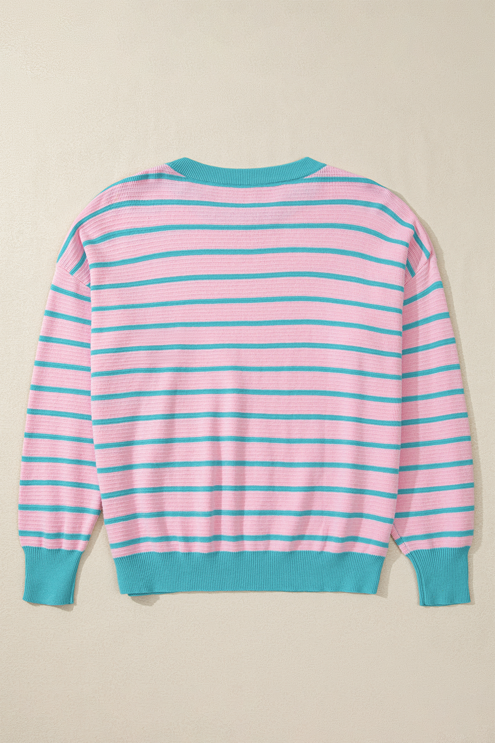 Loose sweater with pink stripes and round neck, dropped shoulders