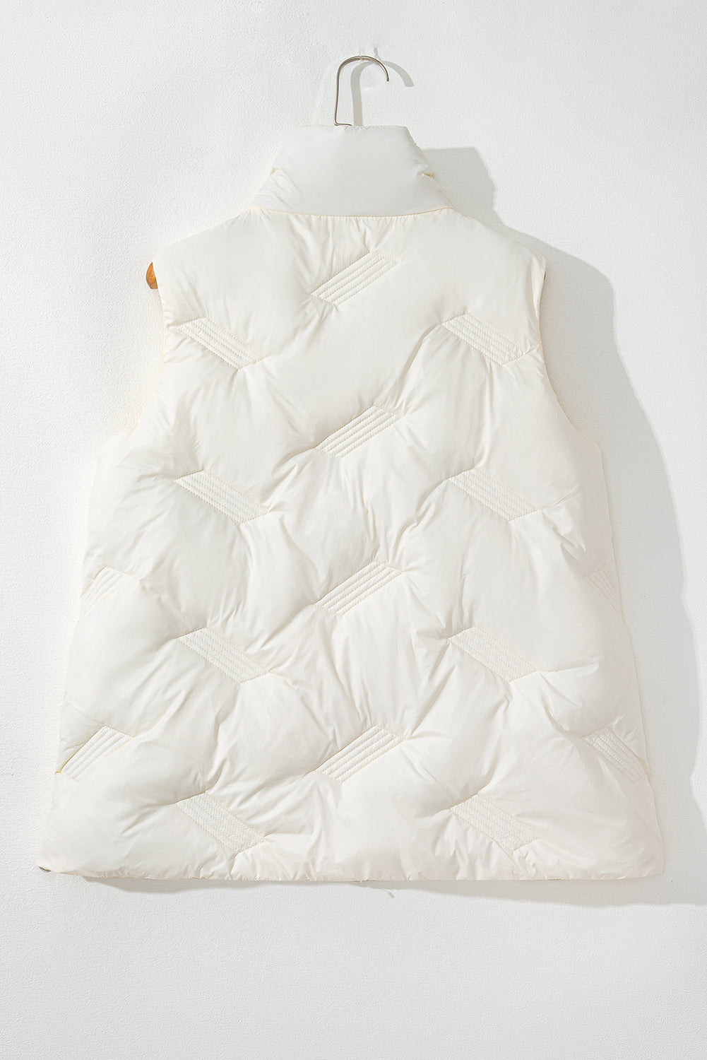 White quilted jacket with high collar and zipper