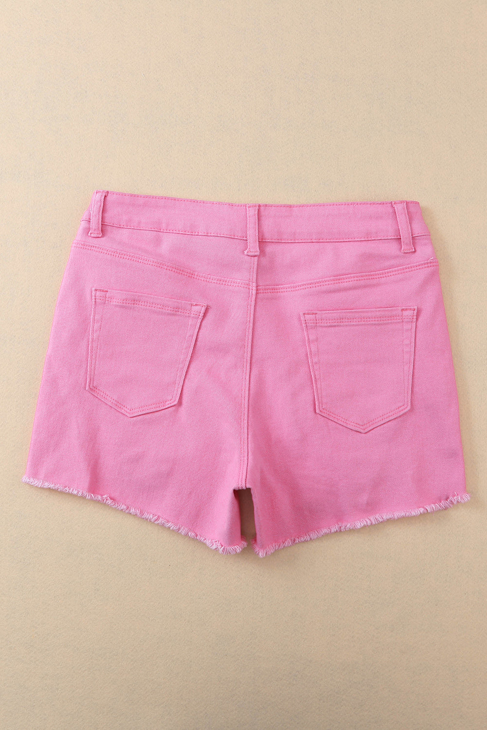 Solid color pink distressed denim shorts