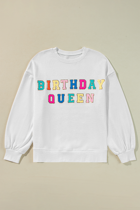 White sweatshirt with balloon sleeves and BIRTHDAY QUEEN print