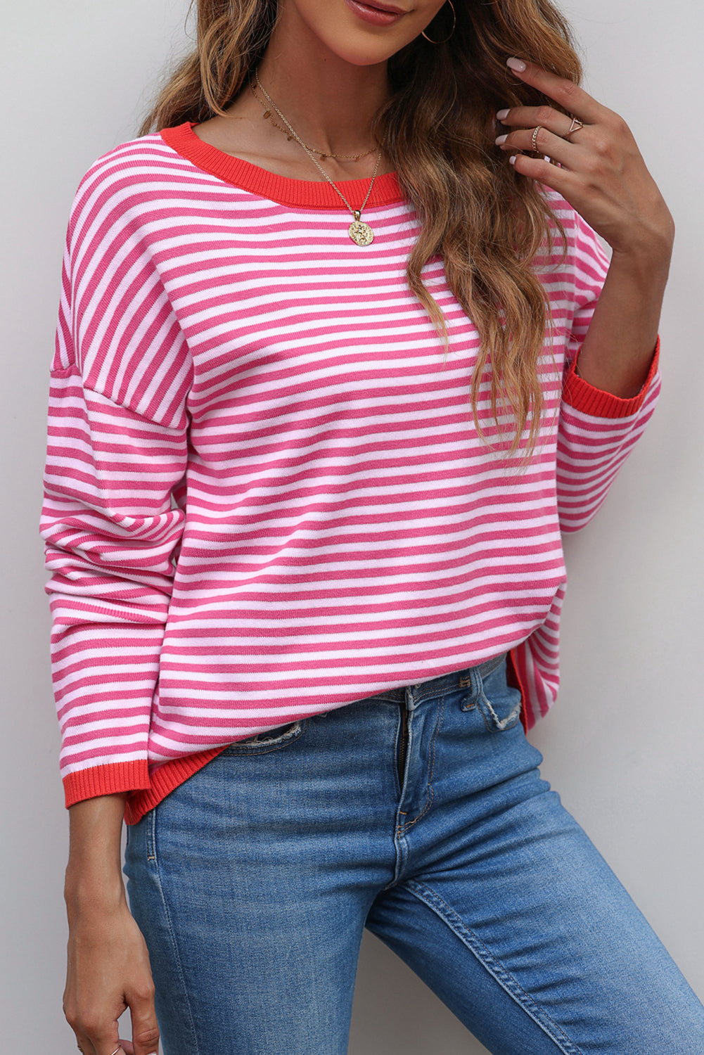 Pink drop shoulder sweater with contrasting edge stripes