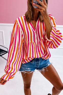 Orange striped blouse, balloon sleeves, notched v collar, buttoned on the front