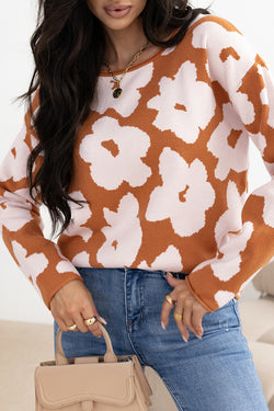 Large brown sweater with long sleeves and round neck with floral pattern