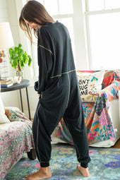 Black baggy jumpsuit with v-neck and flat seam details