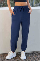 Navy blue drawstring waist jogging pants with solid color fleece lining