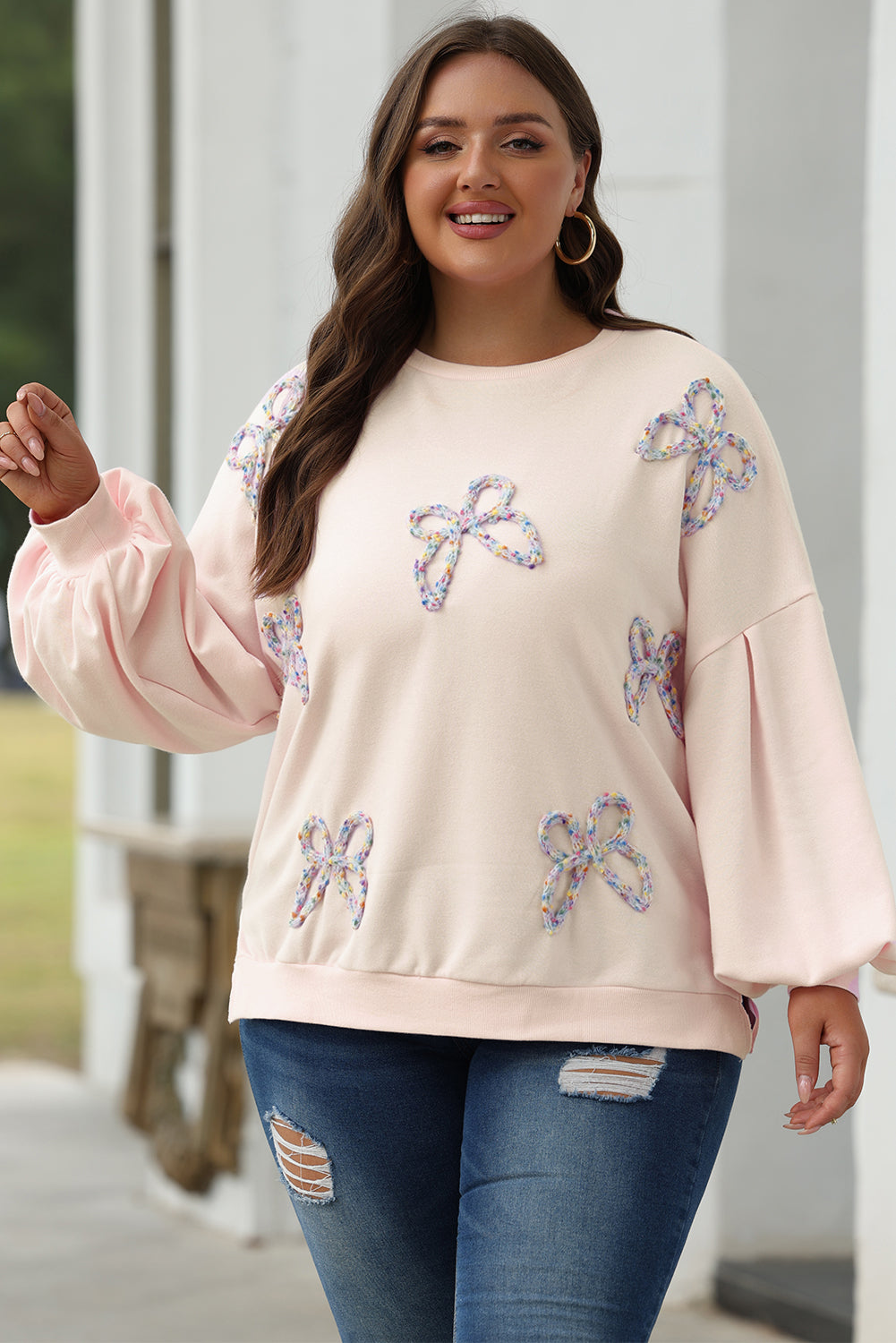 Oversized sweatshirt with lantern sleeves and parchment embroidered bow