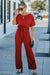 Bright red belted wide leg jumpsuit