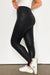 Elegantes leggings de cuero negro con cintura cruzada