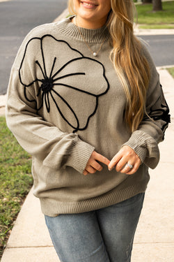 Plus size dark khaki sweater with large flower pattern, high neck, dropped shoulders