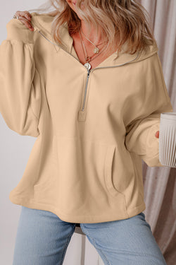 Loose-fitting half-zip hoodie with parchment fleece-lined kangaroo pockets