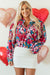 Red blouse with balloon sleeves and floral print, half-boutons