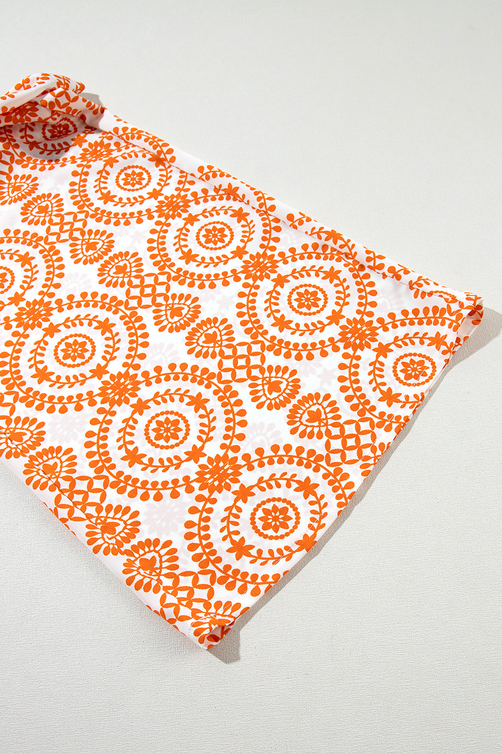 Orange wide leg pants with floral print in retro bohemian style