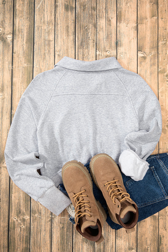 Light gray sweatshirt with stand-up collar and kangaroo pocket with quarter-turn zip