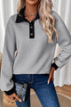 Light gray textured sweatshirt with color block edges and button-down collar