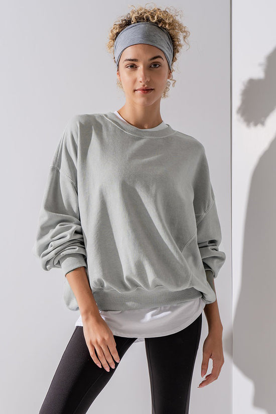 Grey sweatshirt with exposed seams, batwing sleeves and dropped shoulders