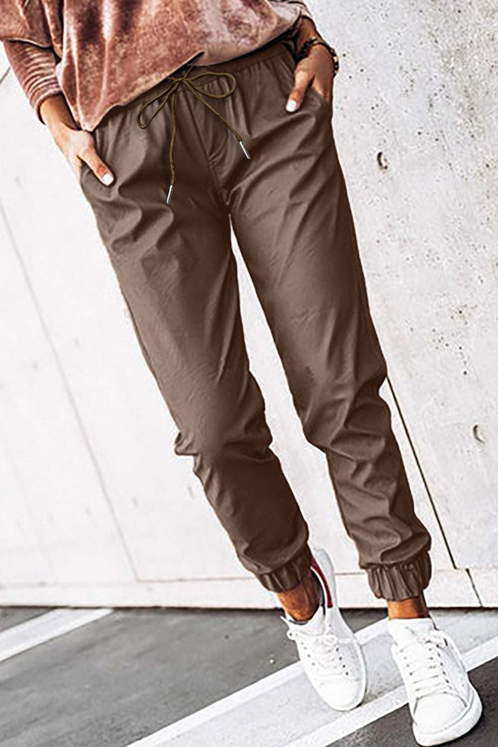 Brown leather jogging pants with waist tie