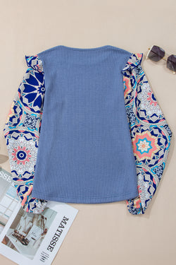 Ashleigh - Blue blouse with ruffles and floral sleeves in woven knitting with round neck